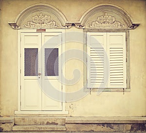 Old wooden door and window in Sino-Portuguese style at old town ; Songkhla Thailand (vintage style)