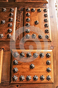 Old wooden door with wrought iron details stair shaped