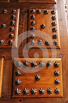 Old wooden door with wrought iron details stair shaped