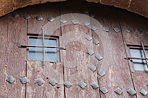 Old wooden door with wrought iron details