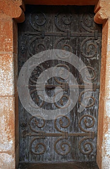 Old wooden door with wrought iron fitting