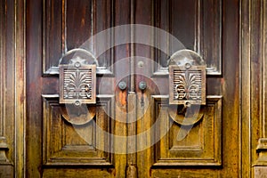 Old wooden doors with architectural detail