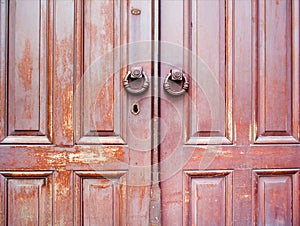 Old wooden doors with round handle