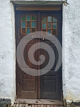Old wooden doors window on old mud house in Vojvodina Serbia