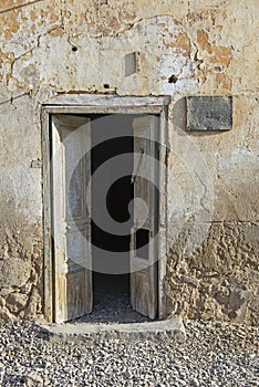 Old wooden doorway in abandoned egyptian house