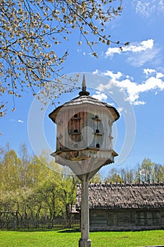Old wooden dovecote. A village dovecote on a wooden stake
