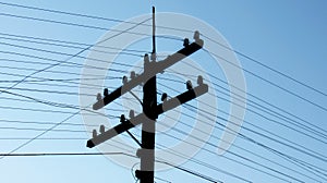 Old wooden electric pole with electrical wires