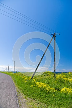 Old wooden electricity post and lines in the countryside