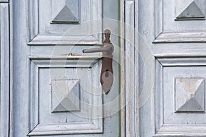 Old wooden entrance door with antique door handle