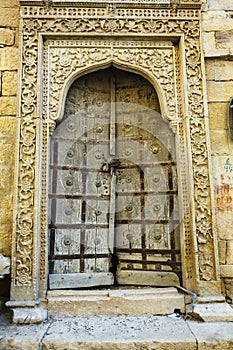 Old wooden entrance door inside the Jaisalmer fortress, Rajasthan, India