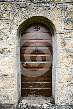 Old wooden entrance door to the Christian church