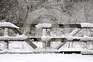 Old Wooden Farm Fence Gate Convered in Winter Snow