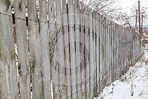Old wooden fence in a russian village