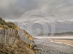 Old wooden fence on sandy dune and Strandhill beach in county Sligo Ireland,
