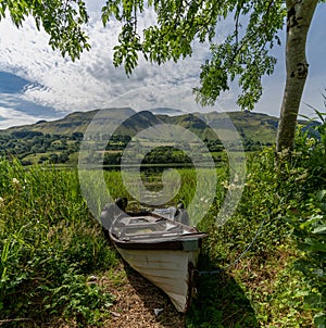 Old wooden fishing boat on the shores of Glencar Lough