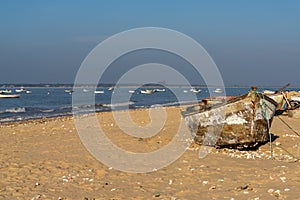 Old wooden fishing boats on the beach at Sanlucar de Barrameda