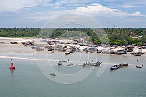 Old wooden fishing boats during low-tide