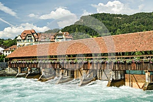 Old wooden floodgates on Aare river in Thun