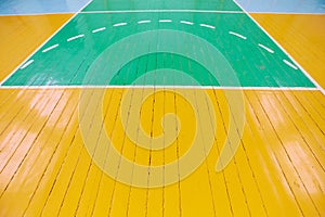 The old Wooden floor of sports hall with marking lines. Background image