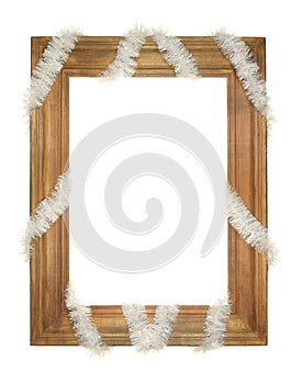 Old wooden frame entwined with a festive garland isolated on a white background