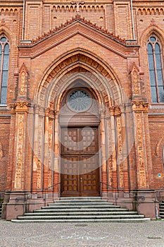 Old wooden front door on old church