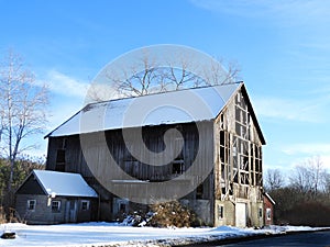Old wooden gable roof storage barn in FLX winter