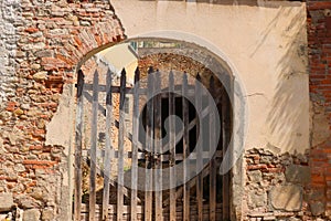 Old wooden gate in an archway