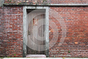 Old wooden gate in brick wall historic taipei