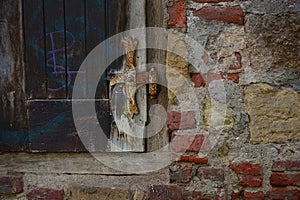 Old wooden gate in the city center.