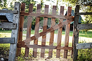 Old Wooden Gate and Fence Around a Garden