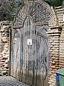 Old wooden gate to Bodbe monastery in Georgia