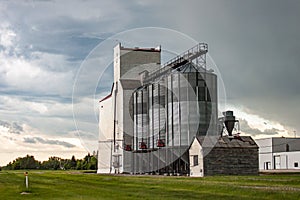 Old Wooden Grain Elevator Against Dramatic Sky