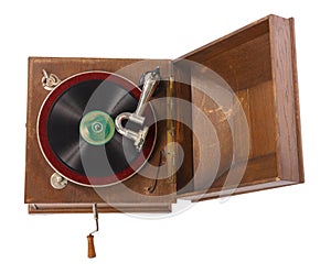 Old wooden gramophone against white background