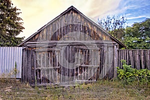 Old wooden granary facade of a beautiful dilapidated barn