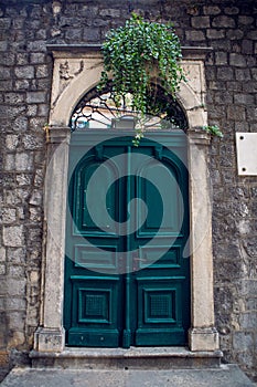 Old wooden green doors in Montenegro