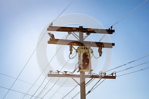 Old wooden high voltage electric pylon