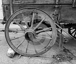 Old wooden horse-drawn wagon wheel and brake section