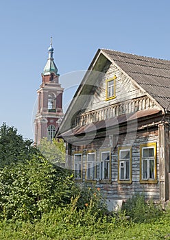 Old wooden house and bell tower