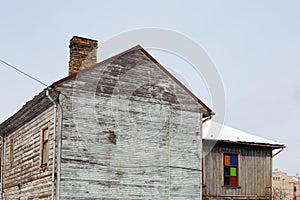 Old wooden house in Riga, Latvia with a colorful window