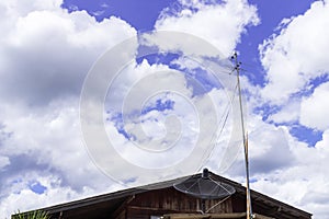 Old wooden house and roof with old retro television antenna