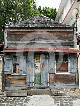 Old wooden house with roof shingles in Port Louis, Mauritius