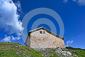 an old wooden house on top of a mountain in Bad Gastein