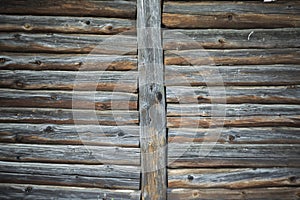 Old wooden house wall in the village