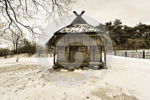 Old wooden house in winter