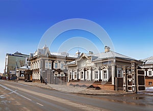 Old wooden houses decorated with traditional Russian carving on Friedrich Engels street. Irkutsk