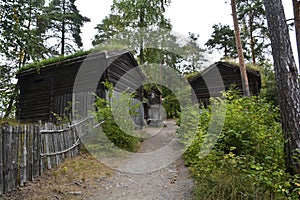 Oslo, Norway, September 2022: Old wooden houses with grass roofs exhibited at The Norwegian Museum of Cultural History