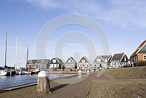 Old wooden houses at harbor of old dutch village Marken
