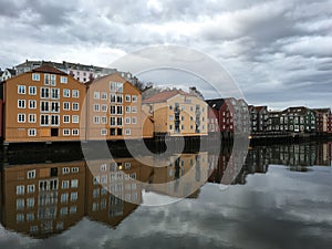 Old wooden houses with Nidelva river, Trondheim, Norway.