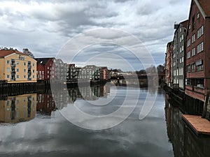 Old wooden houses with Nidelva river, Trondheim, Norway.