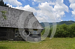 Old wooden houses in the traditional Carpathian style in ethnographic museum Old Village, Kolochava